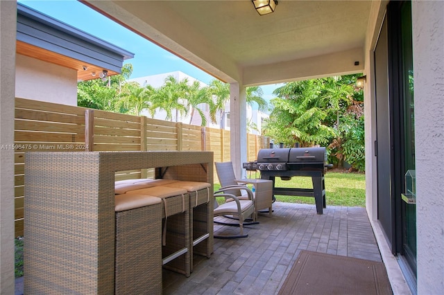 view of patio with a grill