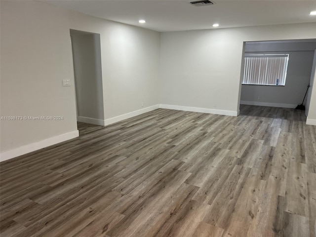 empty room featuring wood-type flooring