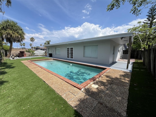 view of pool featuring a yard