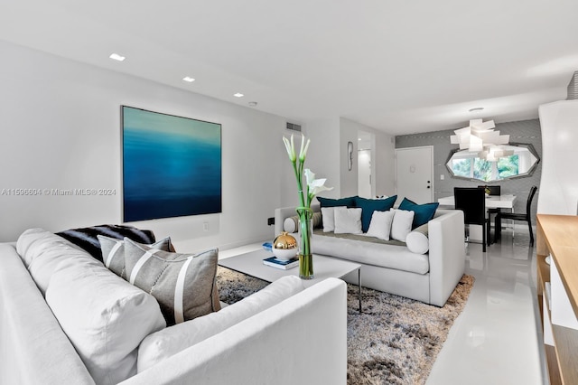 interior space featuring backsplash, light tile patterned floors, sink, and white cabinetry