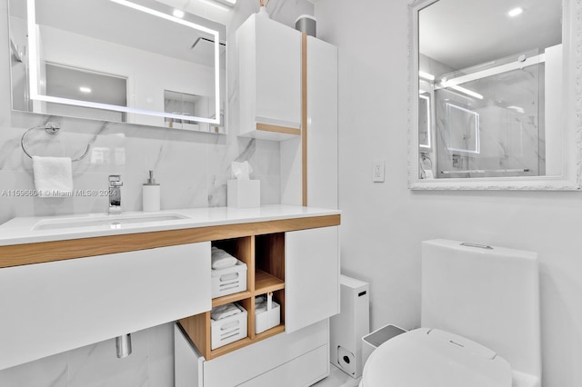 bathroom featuring backsplash, vanity, and toilet