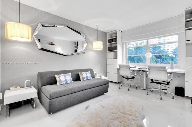 living room featuring light tile patterned floors and built in desk