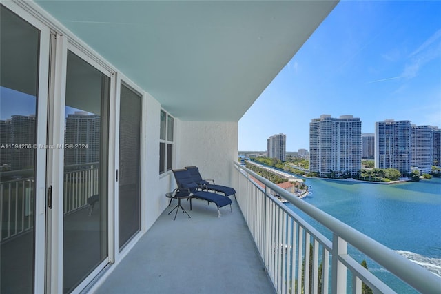 balcony featuring a water view