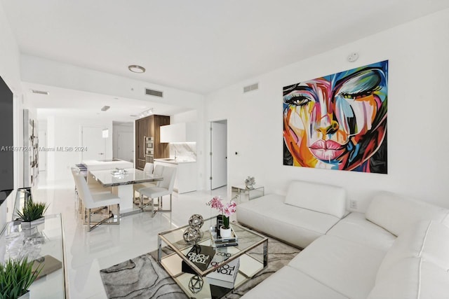 living room featuring light tile floors