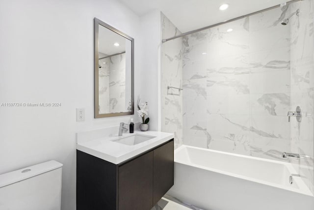 full bathroom featuring vanity, toilet, and tiled shower / bath combo