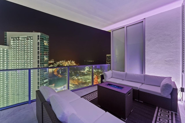 balcony at twilight featuring an outdoor hangout area