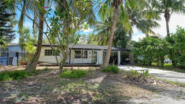 view of front of property featuring a carport