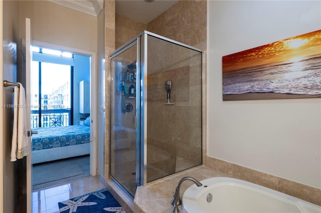 bathroom featuring crown molding, tile flooring, and separate shower and tub