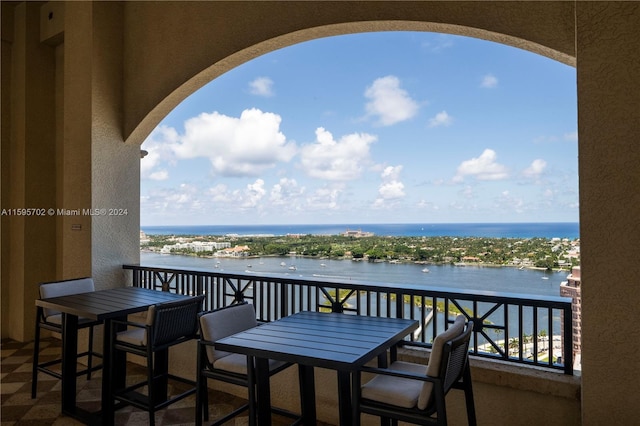 balcony featuring a water view