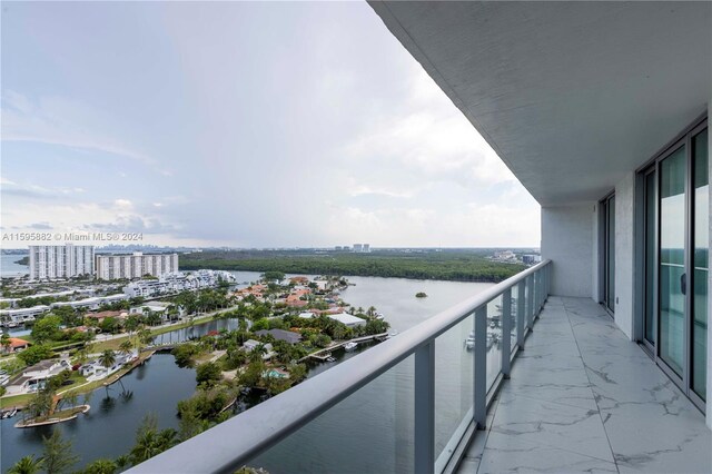 balcony featuring a water view