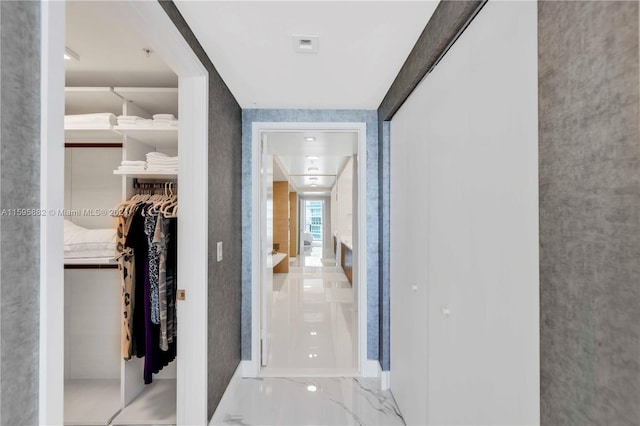 hallway with light tile flooring