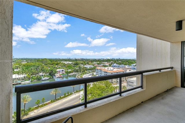 balcony featuring a water view