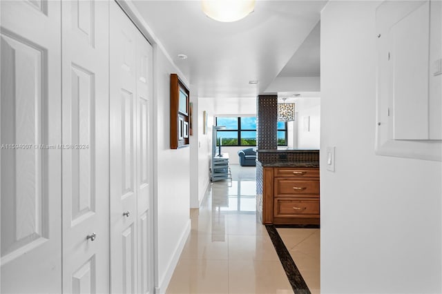 hallway with light tile patterned floors