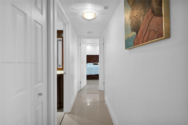 corridor with light tile patterned flooring