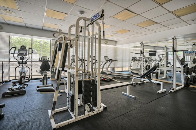 exercise room with a drop ceiling