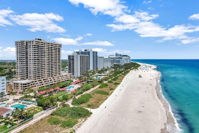 aerial view featuring a water view and a beach view