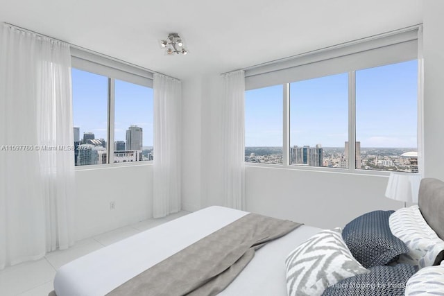 bedroom featuring a city view