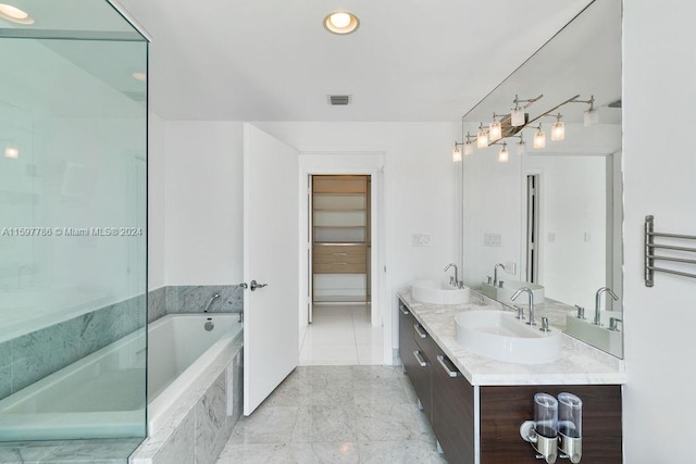 full bath with double vanity, visible vents, a sink, and a bath