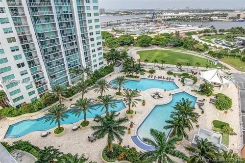 view of pool featuring a water view