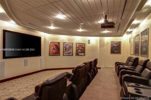 cinema room with carpet floors and baseboards