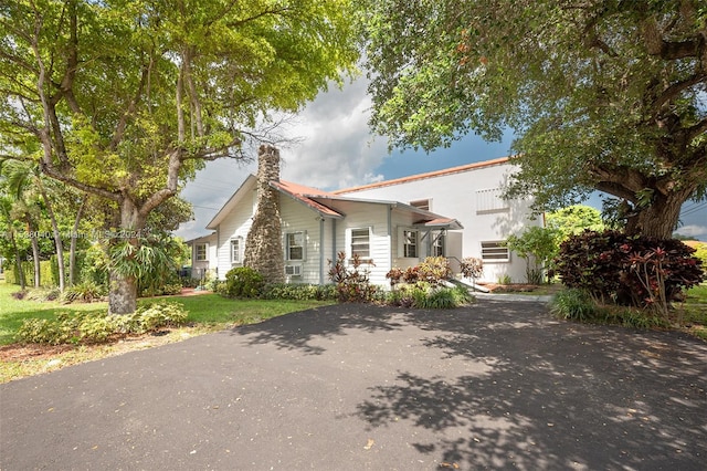 view of front of house featuring cooling unit