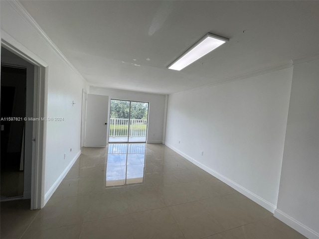 tiled empty room with ornamental molding