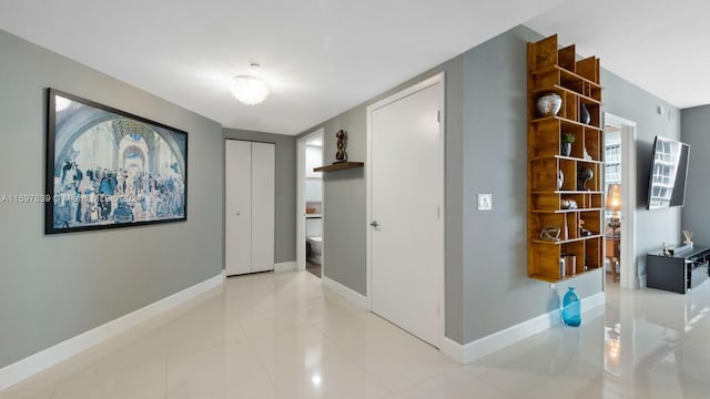 corridor with light tile floors