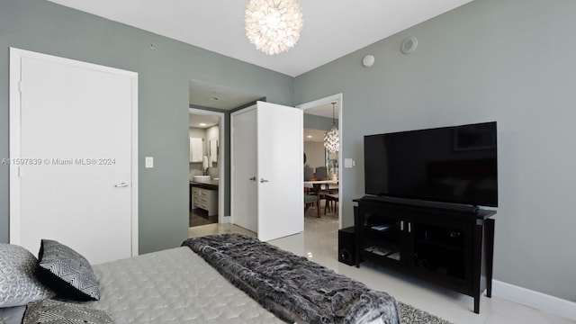 bedroom with an inviting chandelier and ensuite bathroom