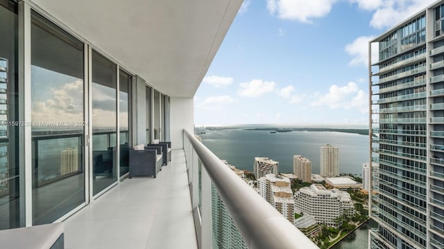 balcony featuring a water view