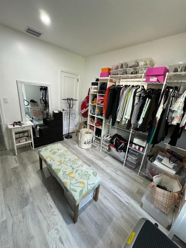 spacious closet with visible vents and wood finished floors