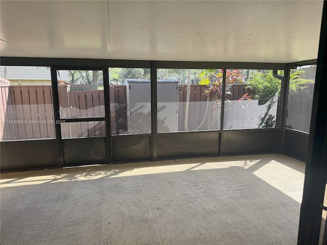 unfurnished sunroom featuring a wealth of natural light