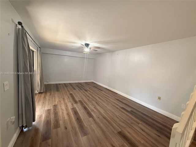 interior space featuring dark hardwood / wood-style flooring and ceiling fan