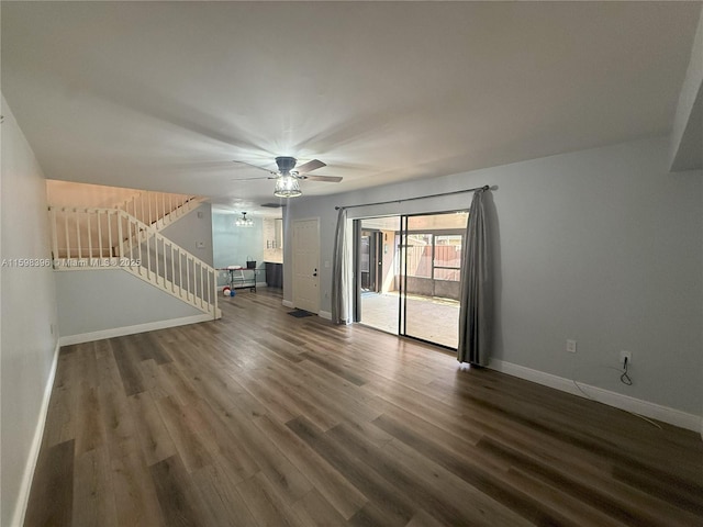 unfurnished living room featuring ceiling fan and hardwood / wood-style floors