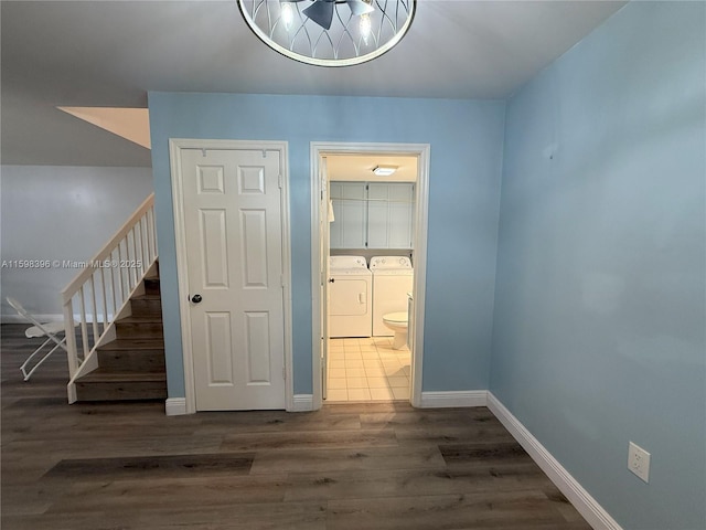 interior space featuring dark wood-type flooring and washing machine and clothes dryer