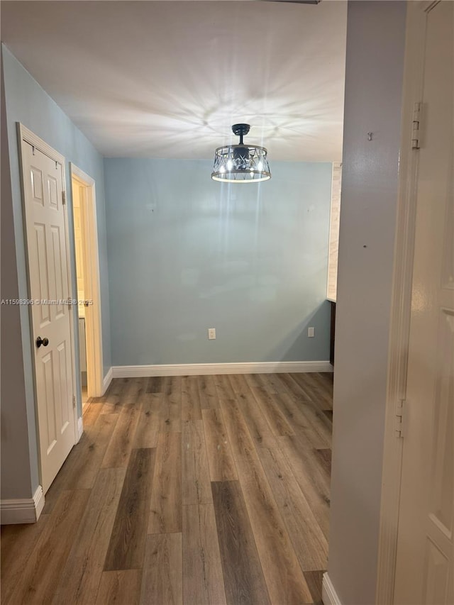 unfurnished dining area with hardwood / wood-style floors