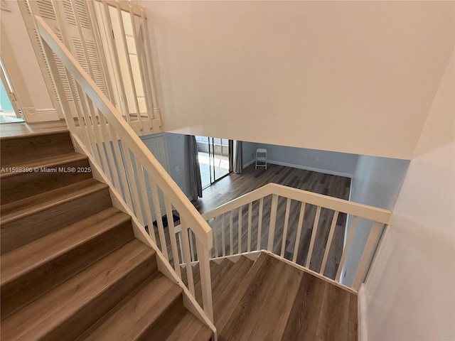 stairway featuring hardwood / wood-style flooring