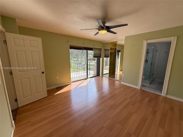 spare room with light hardwood / wood-style floors and ceiling fan