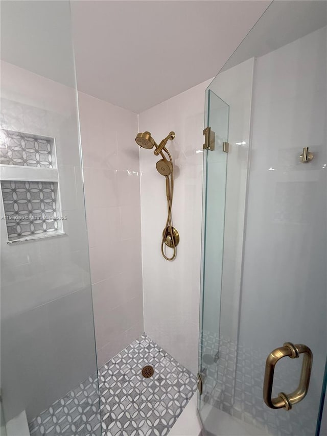 bathroom featuring an enclosed shower