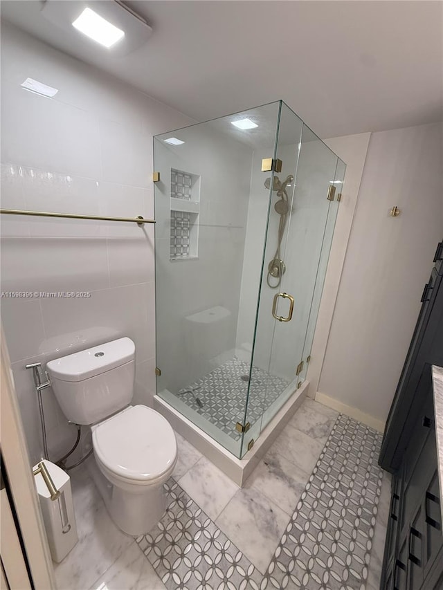 bathroom featuring toilet and walk in shower