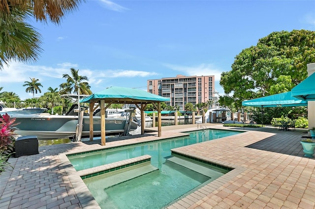 view of swimming pool featuring a patio area