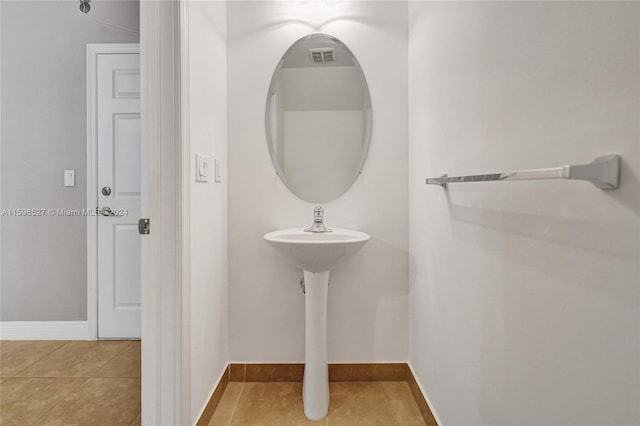 bathroom with tile patterned flooring