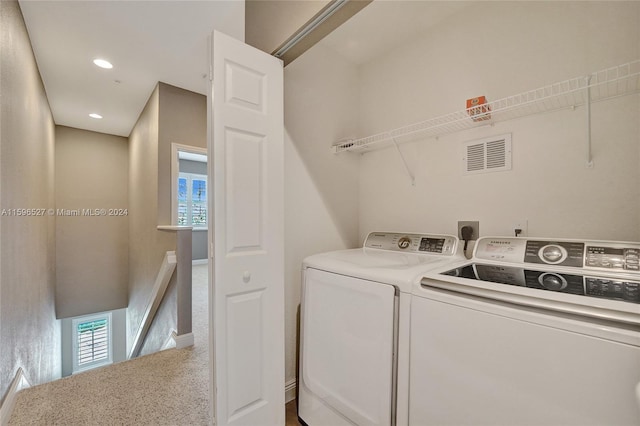 washroom featuring carpet flooring and washing machine and dryer