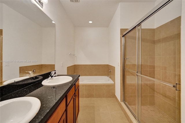 bathroom with tile patterned floors, vanity, and independent shower and bath