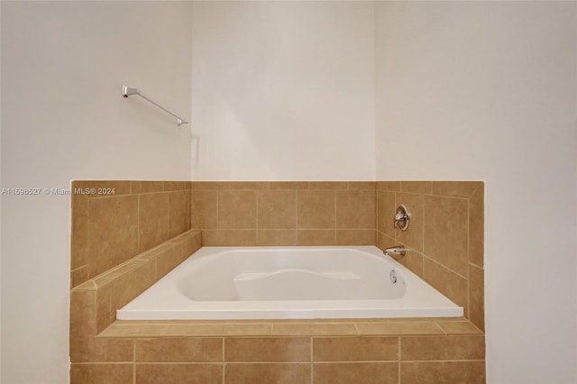 bathroom with tiled tub