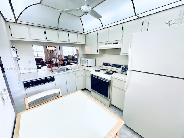 kitchen featuring white cabinets, ceiling fan with notable chandelier, white appliances, and sink