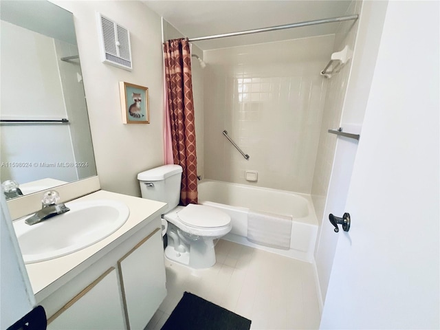 full bathroom with vanity, shower / bath combo, and toilet