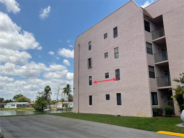 view of building exterior with a water view