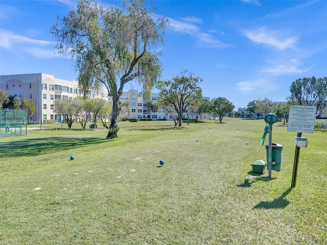 view of property's community featuring a yard