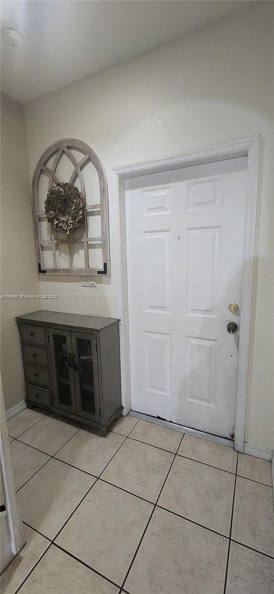 interior space featuring light tile patterned flooring