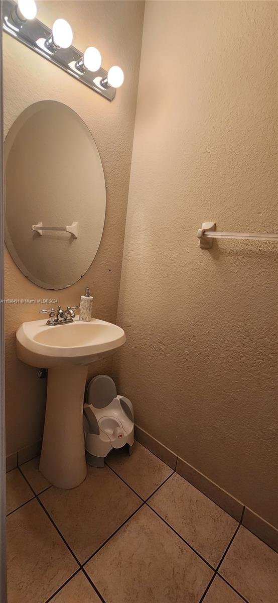 bathroom featuring tile patterned floors and sink